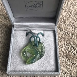 Lalique carved serpent pendant necklace.